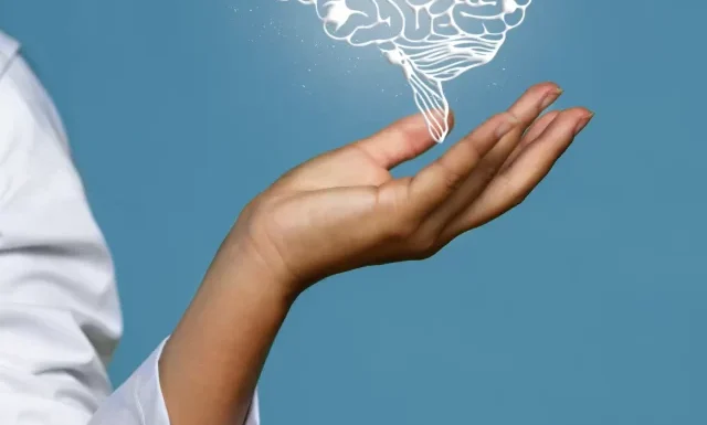 woman-holding-shiny-brain-hologram
